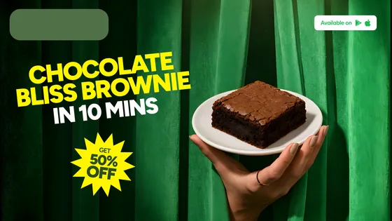 The chocolate bliss brownie SKU at 1920×1080: the plated brownie on the right against the curtain, the yellow copy re-set beside it on the left.